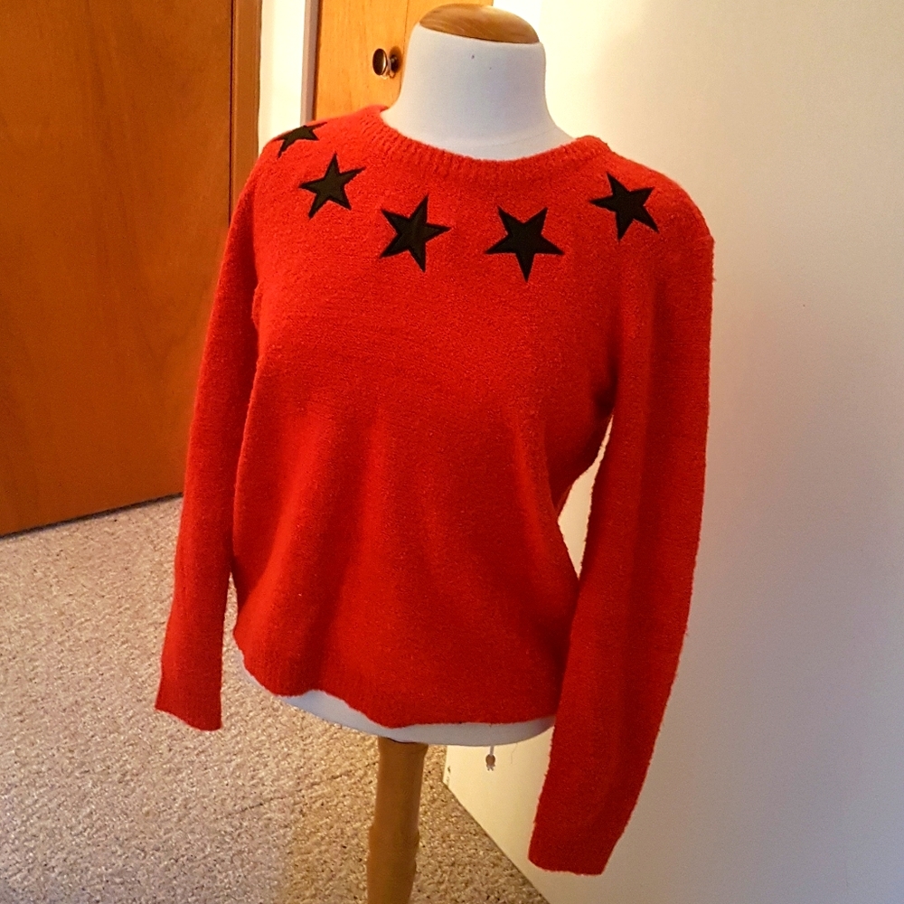 Red sweater with black stars